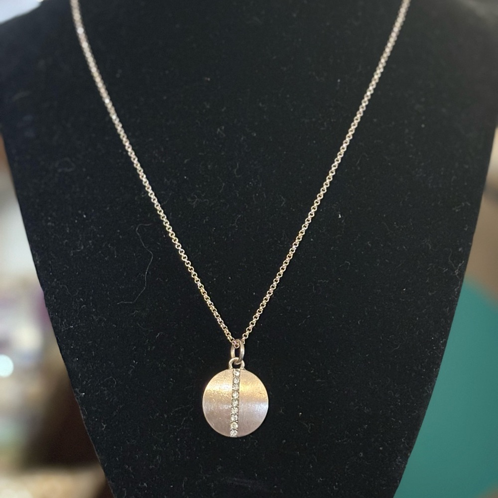 Rose gold tone necklace and pendant with rhinestones. 16” with a 3” extension.